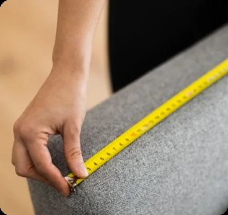 Measuring a sofa with an inch-based visual guide